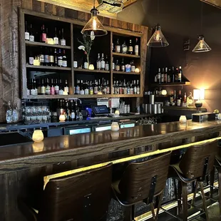 a bar with wooden bar stools