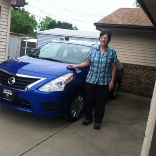 Here is a proud picture of me standing by my new 2015 Nissan Versa Sedan that I purchased from Edward's Nissan!!