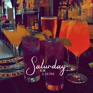 two cocktails on a bar