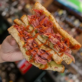 Pastrami with extra Sriracha, Delicious food and great Cocktails with Happy Hour and Live Music .