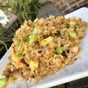 Island Rice, Curry pineapple egg fried rice with chicken ,peas,carrots. Delicious food and great Cocktails with Happy Hour