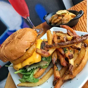 Yummy Edwin Burger w/ Onion ring ,Egg and it comes with house cut fries. Delicious food and great Cocktails with Happy Hour and Live Music