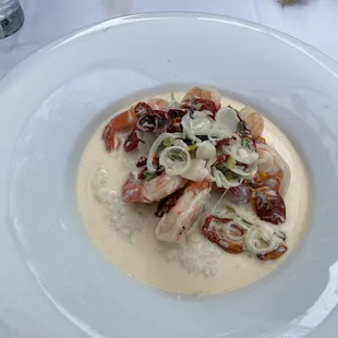 Shrimp + grits - white cheddar grits, oven-dried tomatoes, scallions