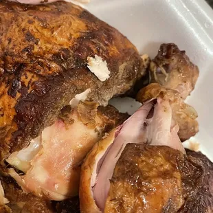 a close up of a piece of meat in a styrofoam container