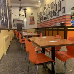 tables and orange chairs