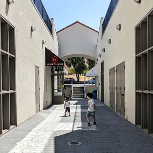 from the back parking lot its down this pathway on the left.