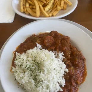 Smothered okra with a side of fries.
