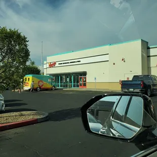 a view of a parking lot from a car window