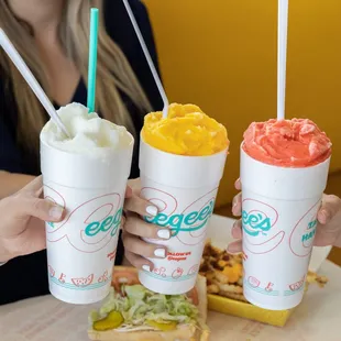 three cups of ice cream and a sandwich