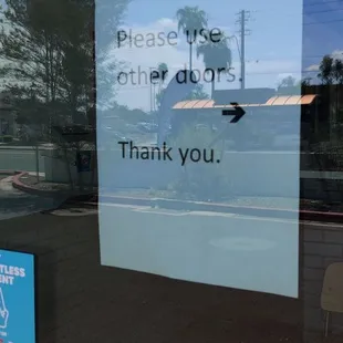 Doors Locked With Signage to Use Other Doors