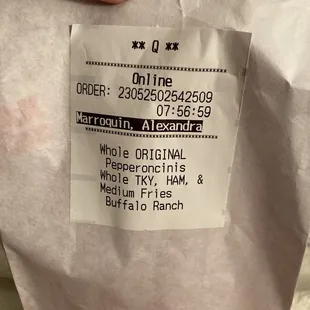 The bag with two sandwiches she tried to hand us
