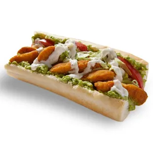 a hot dog with chicken and guacamole