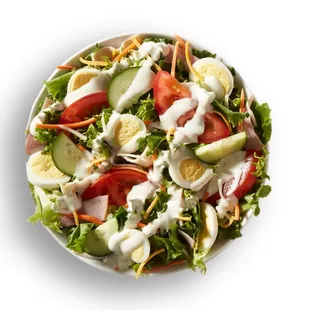 a bowl of salad with dressing