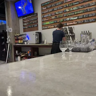 Cool bartender rocking a Kilt.