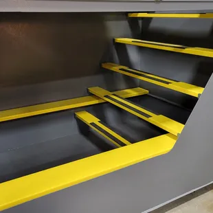 a yellow and black shelf