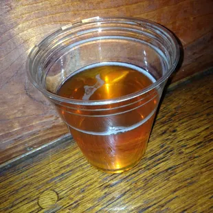 A cup of IPA from a club, yum.