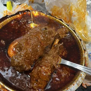 Two pieces of chicken one supposed to be a leg and other a wing 18.00