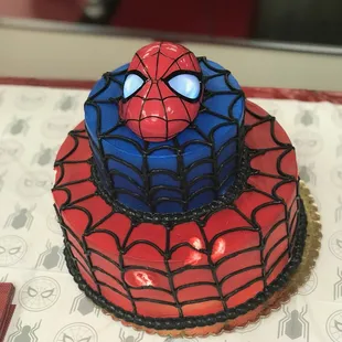 The missing red icing spots were from eager 2 yr olds, not the bakery. The cake was flawless.