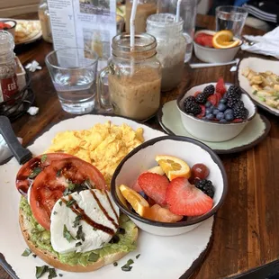 The Caprese avocado toast with eggs and a side of fruit.