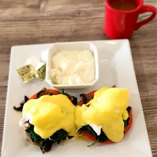 Florentine eggs Benedict with a biscuit and grits with a coffee