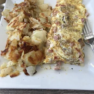 Butcher shop, omelette, home, fries, rye toast.