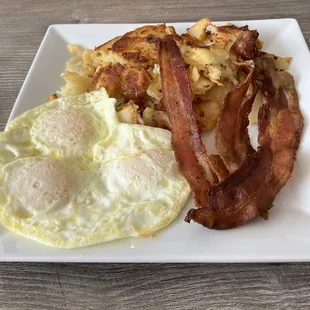 Eggs over medium, bacon, home fries.