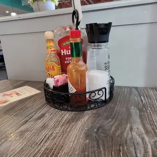a basket of condiments on a table