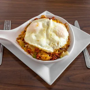 a plate of eggs and hash browns