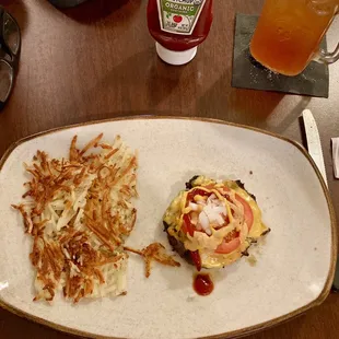 Bunless Akaushi beef cheeseburger, w/ American cheese, tomato, onions, mustard, ketchup, house aioli, and a side of hash browns.