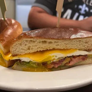 a half eaten sandwich on a plate