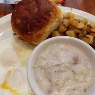 Biscuit and Gravy meal with eggs and home fries. All delicious.