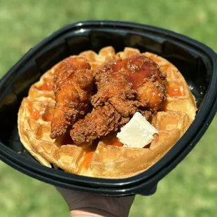 Sweet and savory Chicken &amp; Waffles! Waffle, Fried Chicken Tenders (2) tossed in Nashville Oil, Hot Honey, Side of Butter, Syrup.