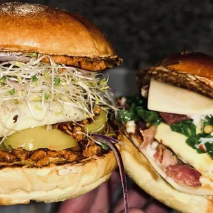 a hand holding a sandwich