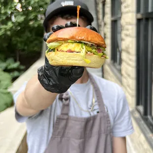 a man holding a sandwich