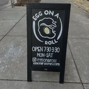 a sign on a sidewalk