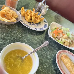 a bowl of soup and a plate of chips
