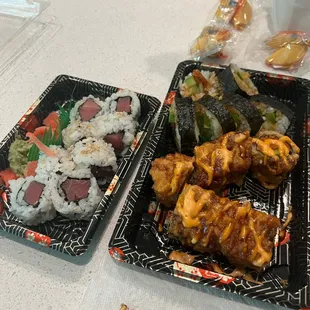 Sushi rolls left to right: tuna, dynamite, and shrimp tempura