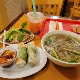a bowl of soup and a plate of rice rolls
