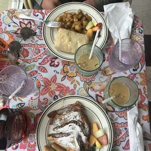 cinnamon french toast with sausage, and breakfast burrito with potatoes