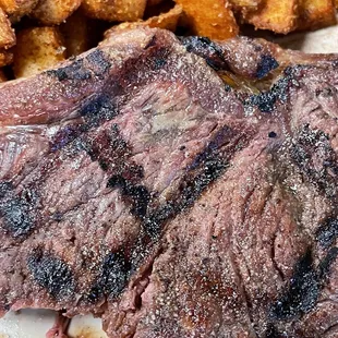 Rotten steak that's still shiny despite grilling and a gray spot that we cut open that was mushy. It wasn't fat.