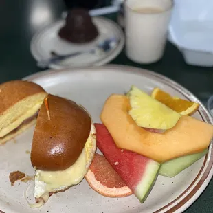 Brioche egg &amp; turkey bacon with Swiss cheese sandwich &amp; a side of fruit &amp; a banana nut muffin