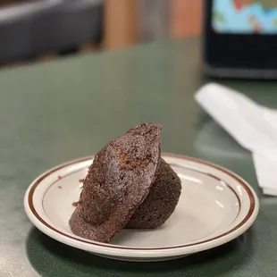 a half eaten chocolate cake on a plate