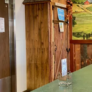 Restrooms through the &quot;outhouse&quot; door.