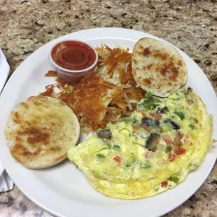 Veggie omelet with hashbrowns and English muffin