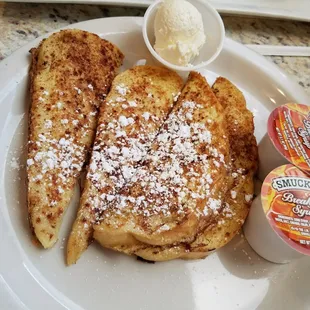 a plate of french toast and yogurt