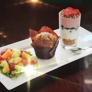 yogurt, fruit salad and muffins