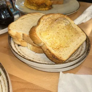 Side of sourdough toast with butter, so delicious thick cut and toasted perfectly