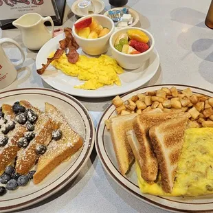 two plates of breakfast food