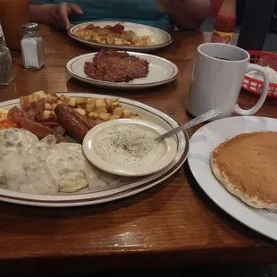 Pancakes,eggs,bacon,sausage,corn beef hash,waffle,grits,sausage gravy and biscuits,home fries,coffee,orange juice.