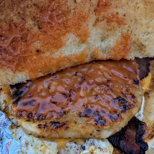 Bacon, Egg, and Cheese Sandwich with added hash browns and sauce